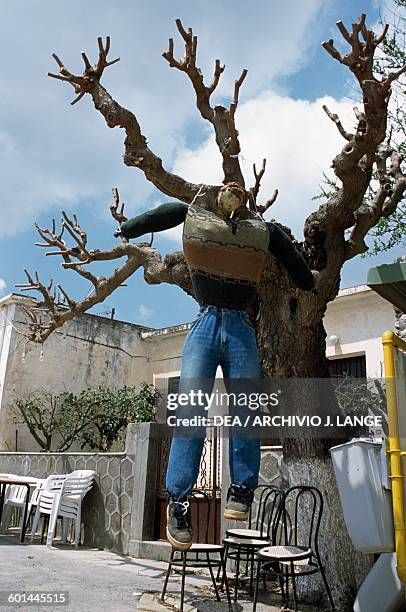Puppet representing Judas hanging from a tree during Easter celebrations, Perivolakia, Crete, Greece.