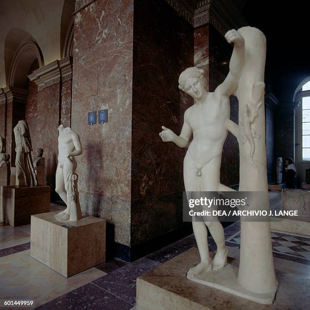 Apollo Sauroctonus, 350-340 BC, marble statue by Praxiteles . Greek civilisation, 4th century BC. Paris, Musée Du Louvre