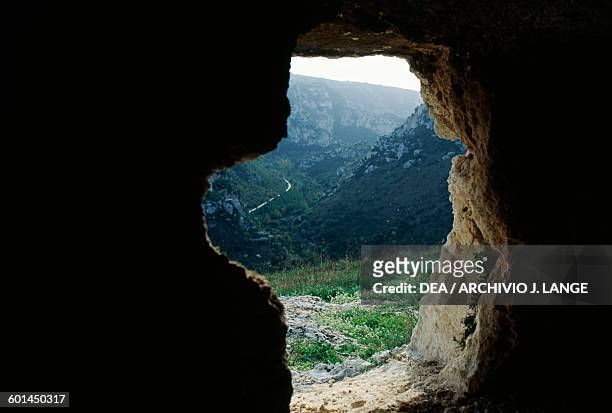 Glimpse of Necropolis of Pantalica from a rock-cut tomb , Sortino, Sicily, Italy. Pantalica culture, 15th-7th century BC.