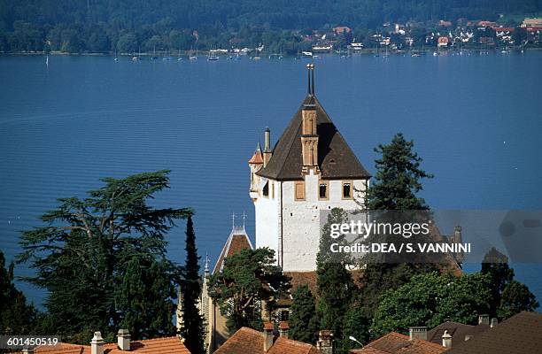 View of Oberhofen Castle and Thun Lake, Canton of Bern, Switzerland.