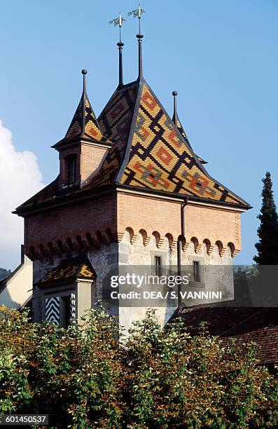 Multi-coloured tiled tower, Oberhofen Castle, Canton of Bern, Switzerland.