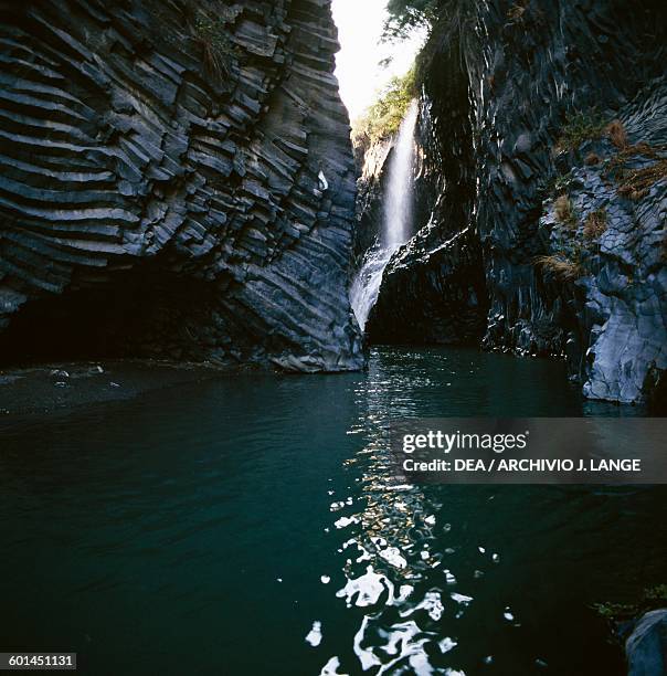 Section of the Alcantara river between stratified and prismatic basalt walls, Alcantara Gorge, Sicily, Italy.