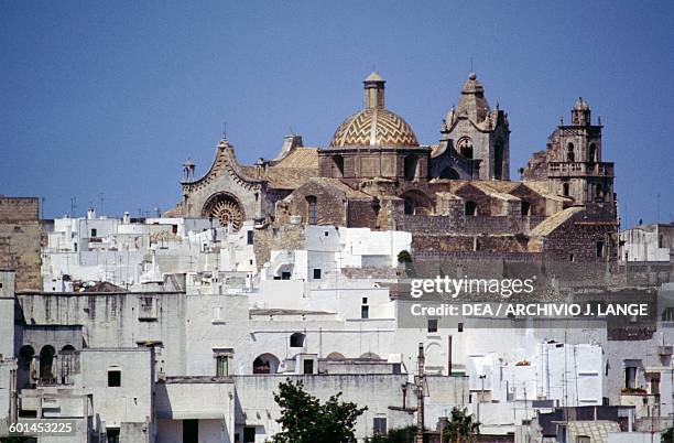 View of Ostuni with the Church of St Vito Martire in the background, Le Murge, Apulia, Italy.