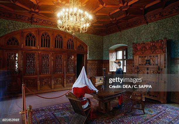 Room with wood panelling and mannequins evoking ghostly legends, Bojnice castle. Slovakia, 12th-19th century.