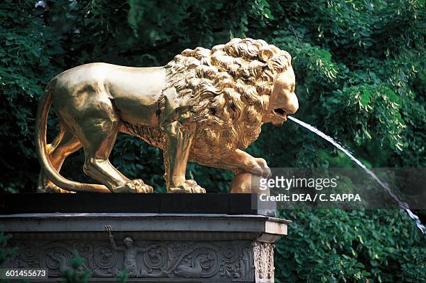 Gilded lion, detail of Lion Fountain, Glienicke Castle, designed by Karl Friedrich Schinkel for Prince Charles of Prussia in 1826, Berlin. Germany,...
