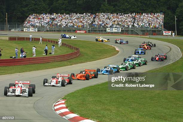 Gil de Ferran and Marlboro Team Penske teammate Helio Castroneves lead at the start of the Miller Lite 200, Round 13 of the C.A.R.T FedEx...