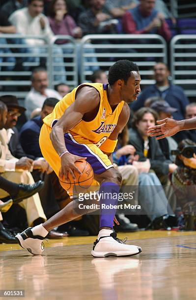 Kobe Bryant of the Los Angeles Lakers dribbles the ball during the NBA game against the Dallas Mavericks at Staples Center in Los Angeles,...