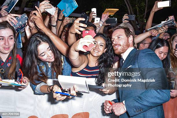 Actor Michael Fassbender interacts with fans at the 'Trespass Against Us' premiere during the 2016 Toronto International Film Festival at Princess of...