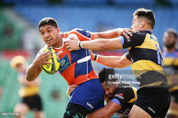 Apolosi Latunipulu of the Rams is tackled during the round three NRC match between the Western Sydney Rams and the Perth Spirit at Concord Oval on...