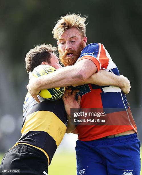 Rhys Allen of the Rams is tackled during the round three NRC match between the Western Sydney Rams and the Perth Spirit at Concord Oval on September...