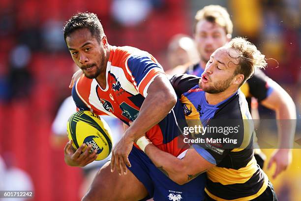 Denny Godinet of the Rams is tackled by Bill Meakes of the Spirit during the round three NRC match between the Western Sydney Rams and the Perth...