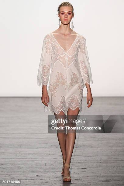 Model walks the runway wearing Tadashi Shoji Spring 2017 at The Arc, Skylight at Moynihan Station during New York Fashion Week on September 9, 2016...