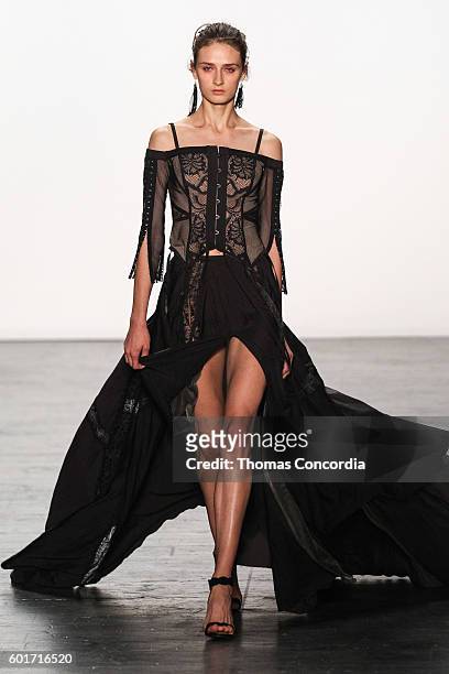 Model walks the runway wearing Tadashi Shoji Spring 2017 at The Arc, Skylight at Moynihan Station during New York Fashion Week on September 9, 2016...