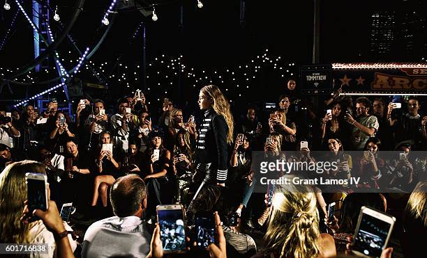 Gigi Hadid walks the runway at the #TOMMYNOW Women's Fashion Show during New York Fashion Week at Pier 16 on September 9, 2016 in New York City.