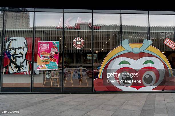 Restaurant in the first floor of a shopping mall, with a traditional Chinese monkey king face on the shopwindow. Primavera Capital and Ant Financial...