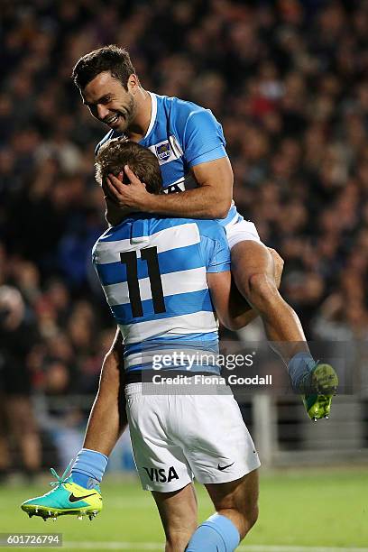 Martin Landajo of Argentina congratulates team mate Santiago Cordero after he scores a try in the first minutes during the Rugby Championship match...