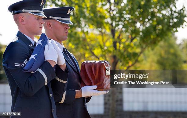Air Force color guards with flag and urn carrying the remains of WWII WASP Elaine Harmon at Arlington National Cemetery in Arlington, VA on September...