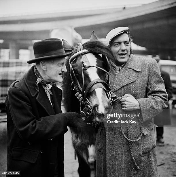 Actors Wilfrid Brambell and Harry H. Corbett in character to publicise the latest series of the British sitcom 'Steptoe and Son', UK.