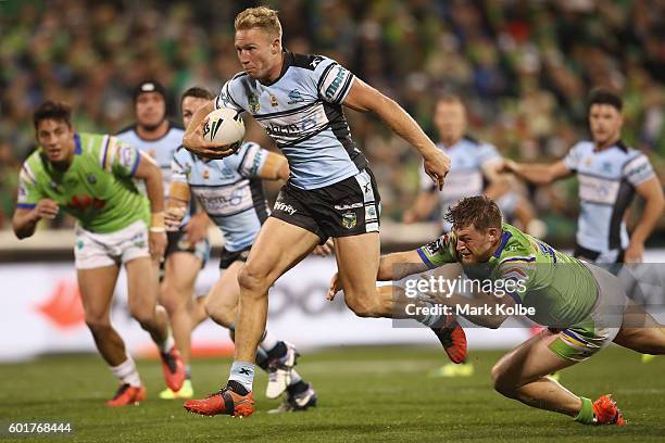 Matt Prior of the Sharks makes a break on his way to score a try during the NRL Qualifying Final match between the Canberra Raiders and the Cronulla...