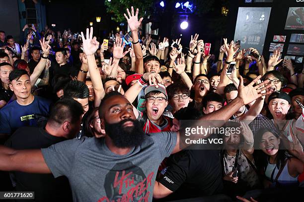American basketball player James Harden interacts with fans at New World Taiping Lake Garden on September 9, 2016 in Shanghai, China.