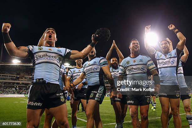 Chris Heighington, Jack Bird, Andrew Fifita and Jesse Sene-Lefao of the Sharks celebrate victory with their team mates during the NRL Qualifying...