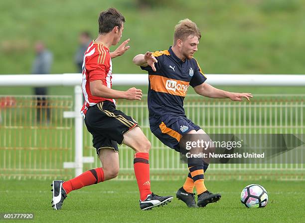 Mackenzie Heaney of Newcastle and Tom Howard of Sunderland challenge during the U18 Premier League match between Sunderland FC U18's and Newcastle...