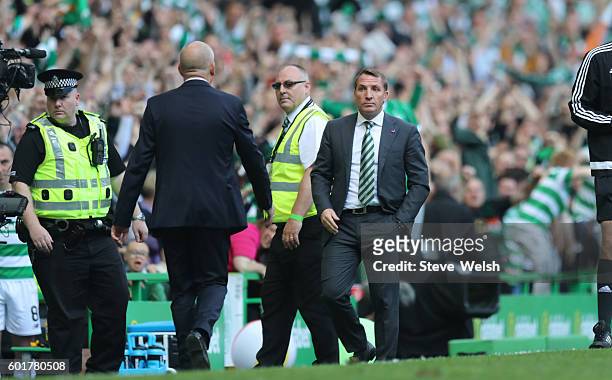 Brendan Rodgers manager of Celtic at the end with Mark Warburton manager of Rangers after the Ladbrokes Scottish Premiership match between Celtic and...