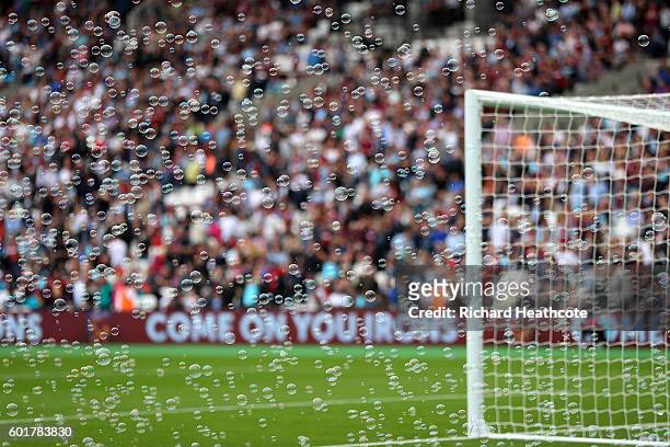 Bubbles are seen inside the stadium prior to kick off during the Premier League match between West Ham United and Watford at Olympic Stadium on...