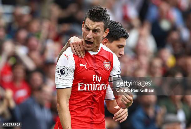 Laurent Koscielny of Arsenal celebrates scoring his sides first goal during the Premier League match between Arsenal and Southampton at Emirates...