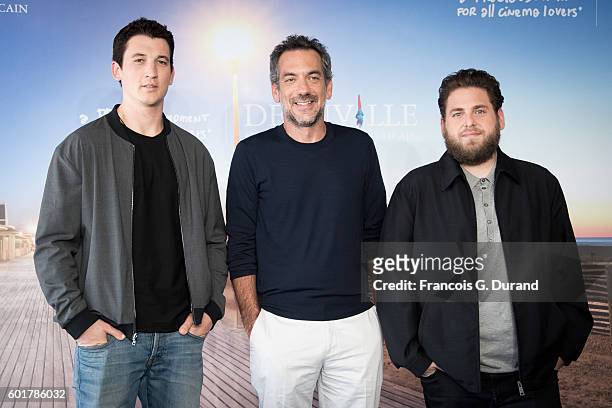 Miles Teller, Todd Phillips and Jonah Hill pose a a photocall for the film "War Dogs" during the 42nd Deauville American Film Festival on September...