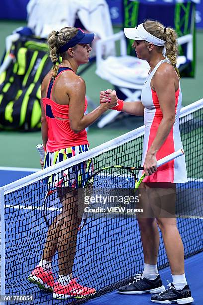 Angelique Kerber of Germany shakes hands with Caroline Wozniacki of Denmark after defeating her during their Women's Singles Semifinal Match of the...