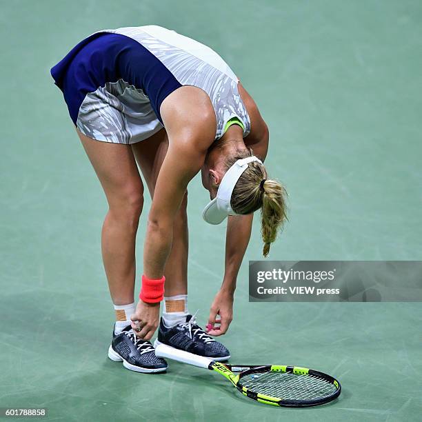 Caroline Wozniacki of Denmark reacts after losing a point against Angelique Kerber of Germany during their Women's Singles Semifinal Match of the...