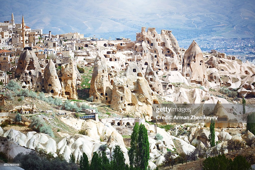 Cappadocia, Turkey - May 02, 2014: View on the town of Goreme located on the ancient tuff rock formations