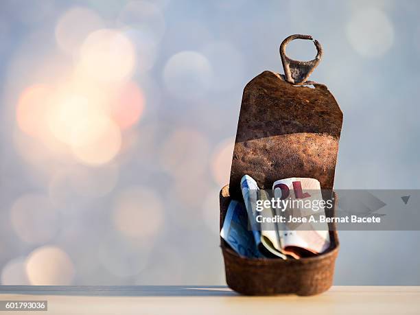 savings in bills of the currency euro, inside a rusty tin of sardines - pictures of containers seized by customs stock pictures, royalty-free photos & images