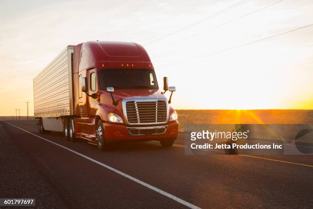 truck driving on remote road - road front view stock pictures, royalty-free photos & images