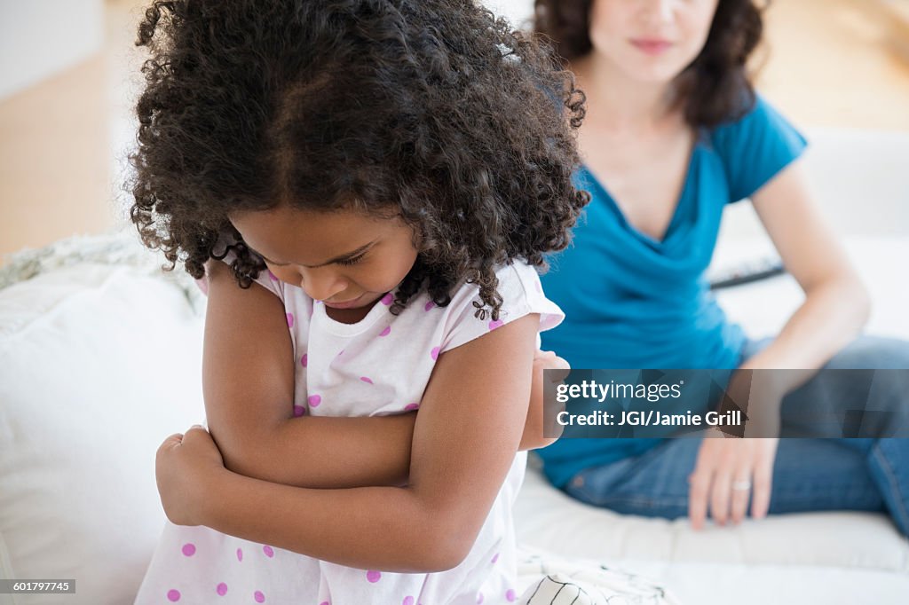 Frustrated girl ignoring mother