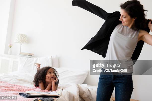 mother and daughter getting ready in bedroom - mother and daughter making the bed stock pictures, royalty-free photos & images
