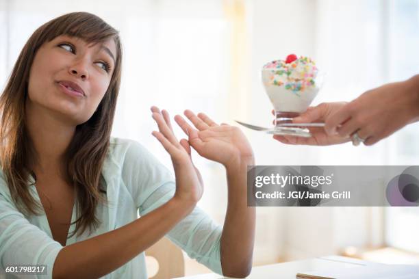 woman refusing unhealthy ice cream - refusing fotografías e imágenes de stock