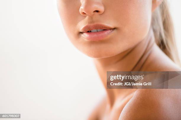 close up of bare shoulder of mixed race woman - beautiful bare women fotografías e imágenes de stock