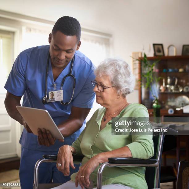 Patient Reading Reference 484 Nurse Reading Patient Chart Stock Photos, High-Res Pictures, and ...
