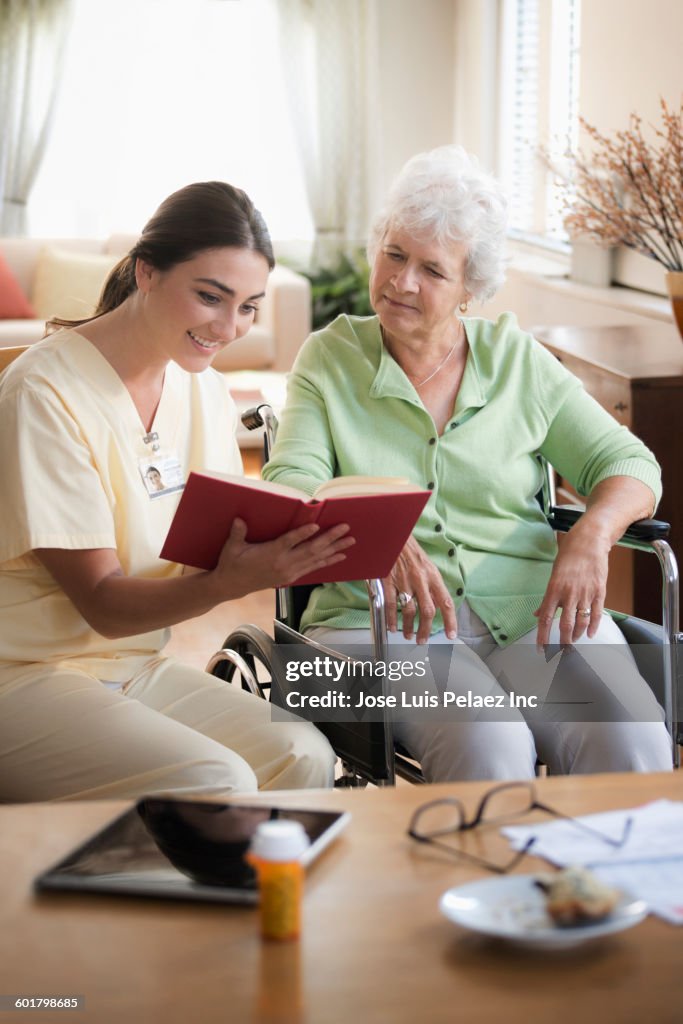 Patient Reading Reference Caucasian Nurse And Patient Reading Book High-Res Stock Photo - Getty ...
