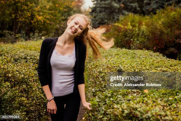 caucasian woman standing in garden - voronezh stock pictures, royalty-free photos & images