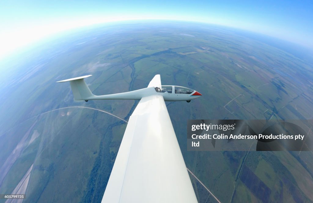 Glider airplane flying in sky