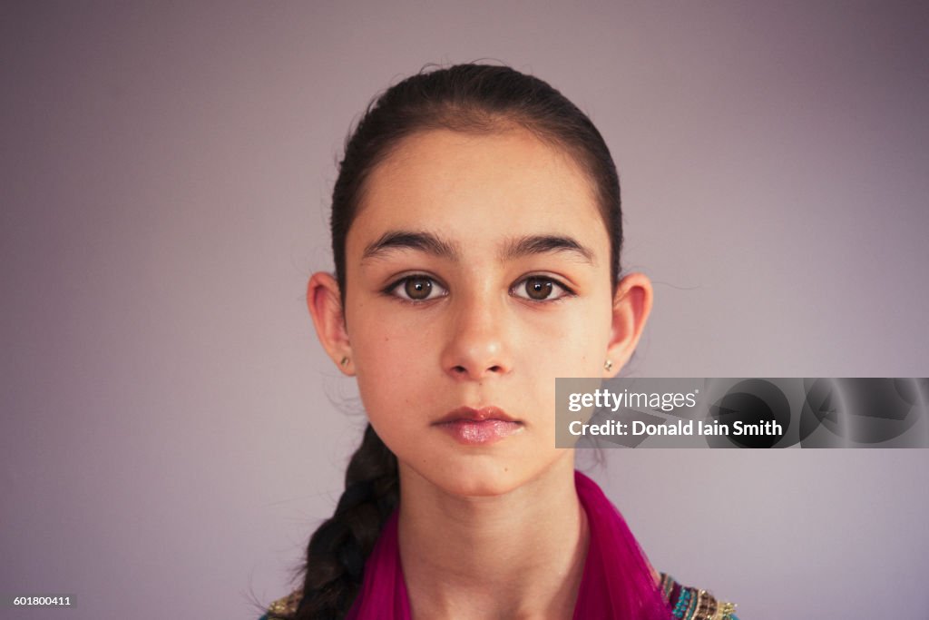 Close up of serious mixed race girl
