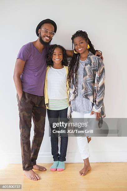 black family smiling - three people white background stock pictures, royalty-free photos & images