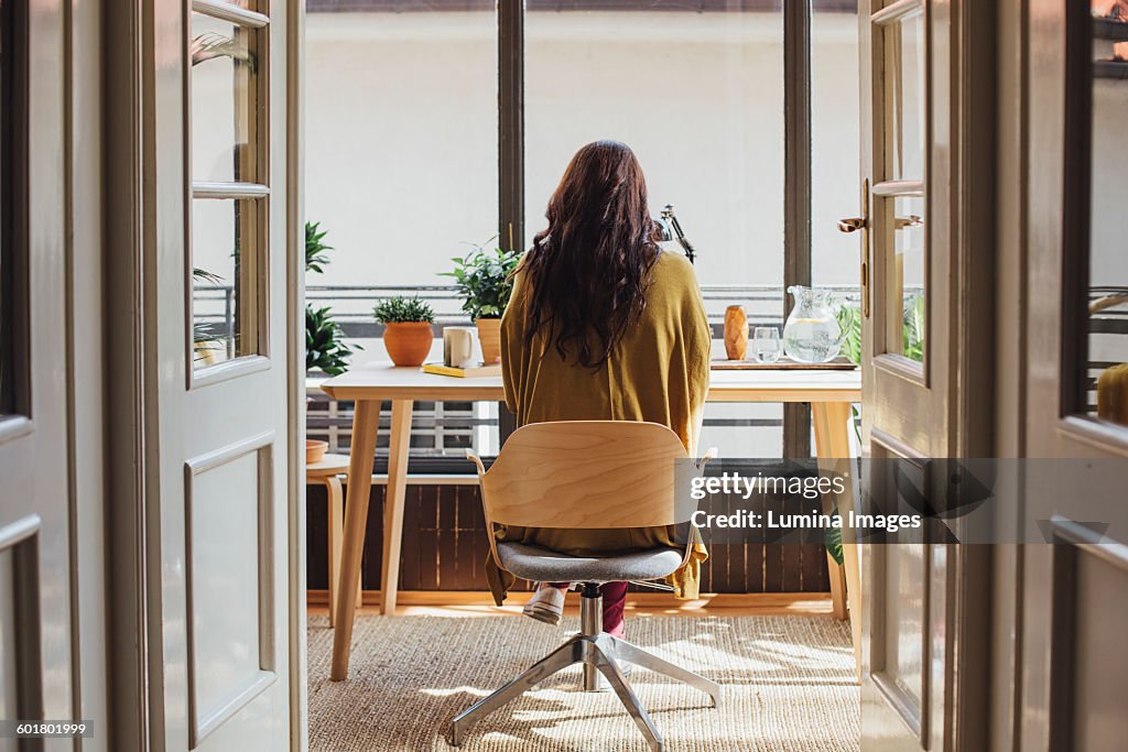 Caucasian woman sitting at desk