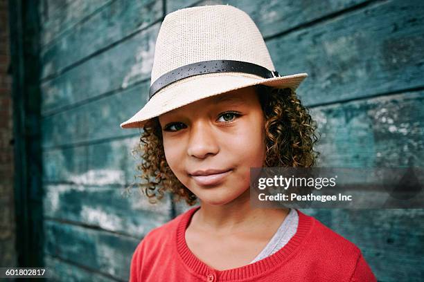 mixed race girl wearing fedora - sombrero fedora fotografías e imágenes de stock