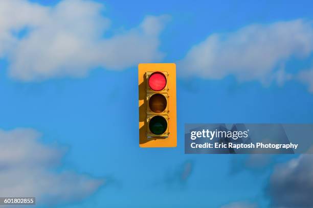 stoplight floating in sky - semaforo fotografías e imágenes de stock
