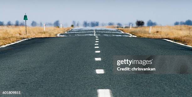 heat haze on road, conargo, new south wales, australia - 熱波 ストックフォトと画像