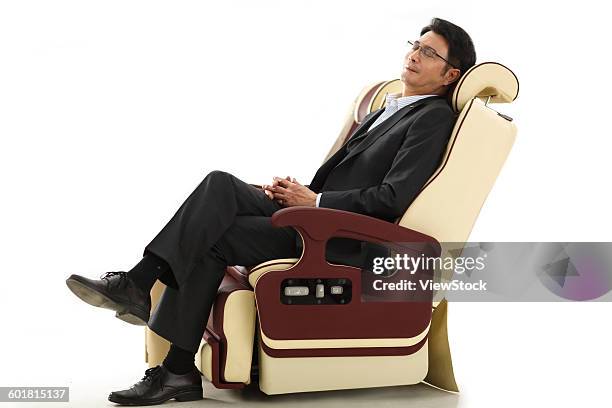 business people lean on the chair. - jet lag stockfoto's en -beelden